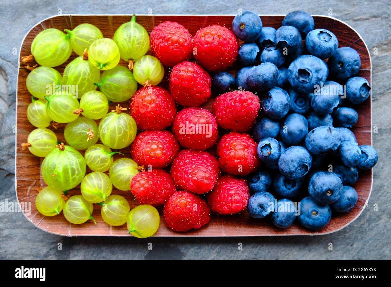 Mix of fruits on slate background Stock Photo