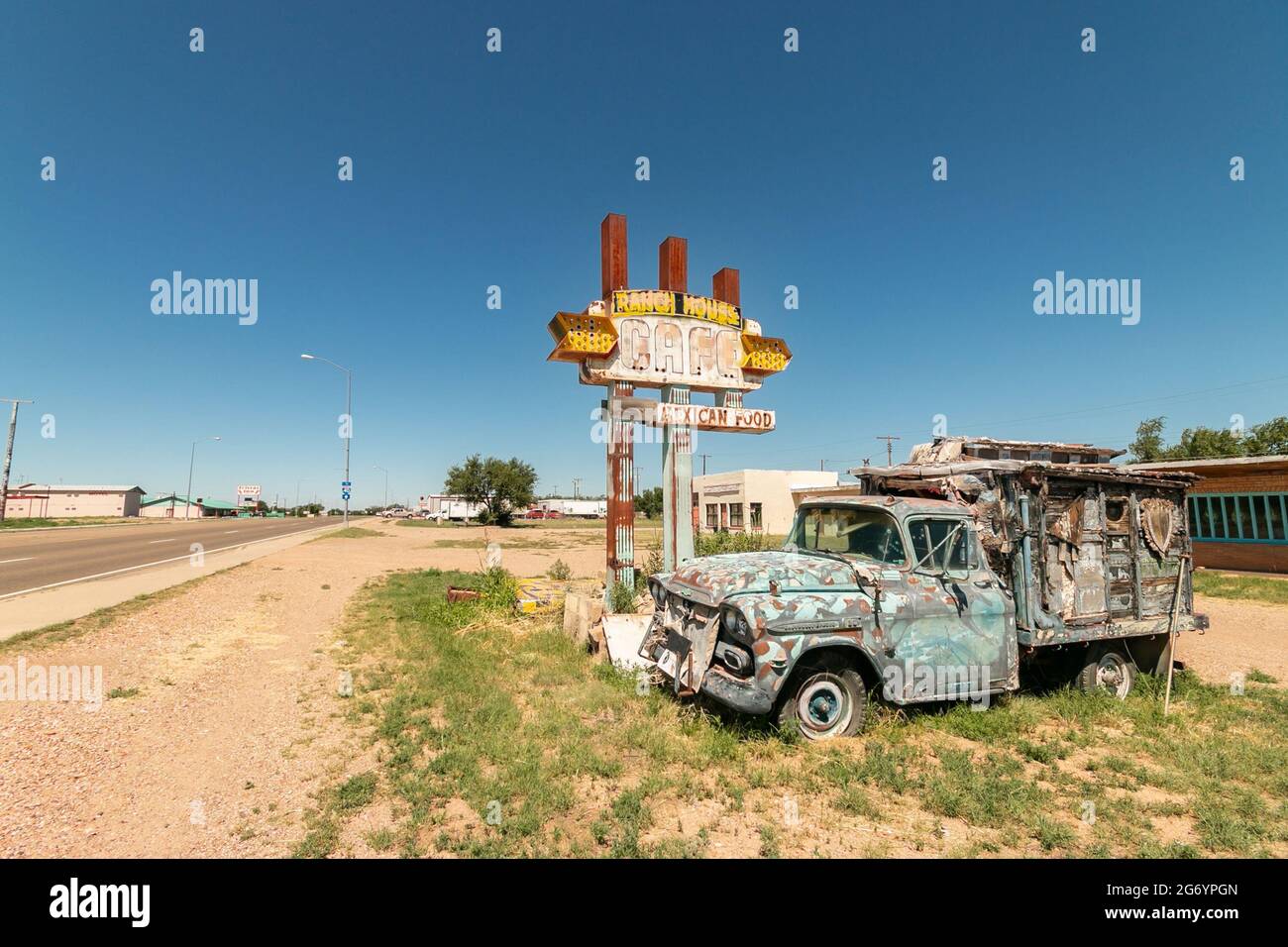 Ranch house Mexican food restaurant sign with dilapidated old truck on