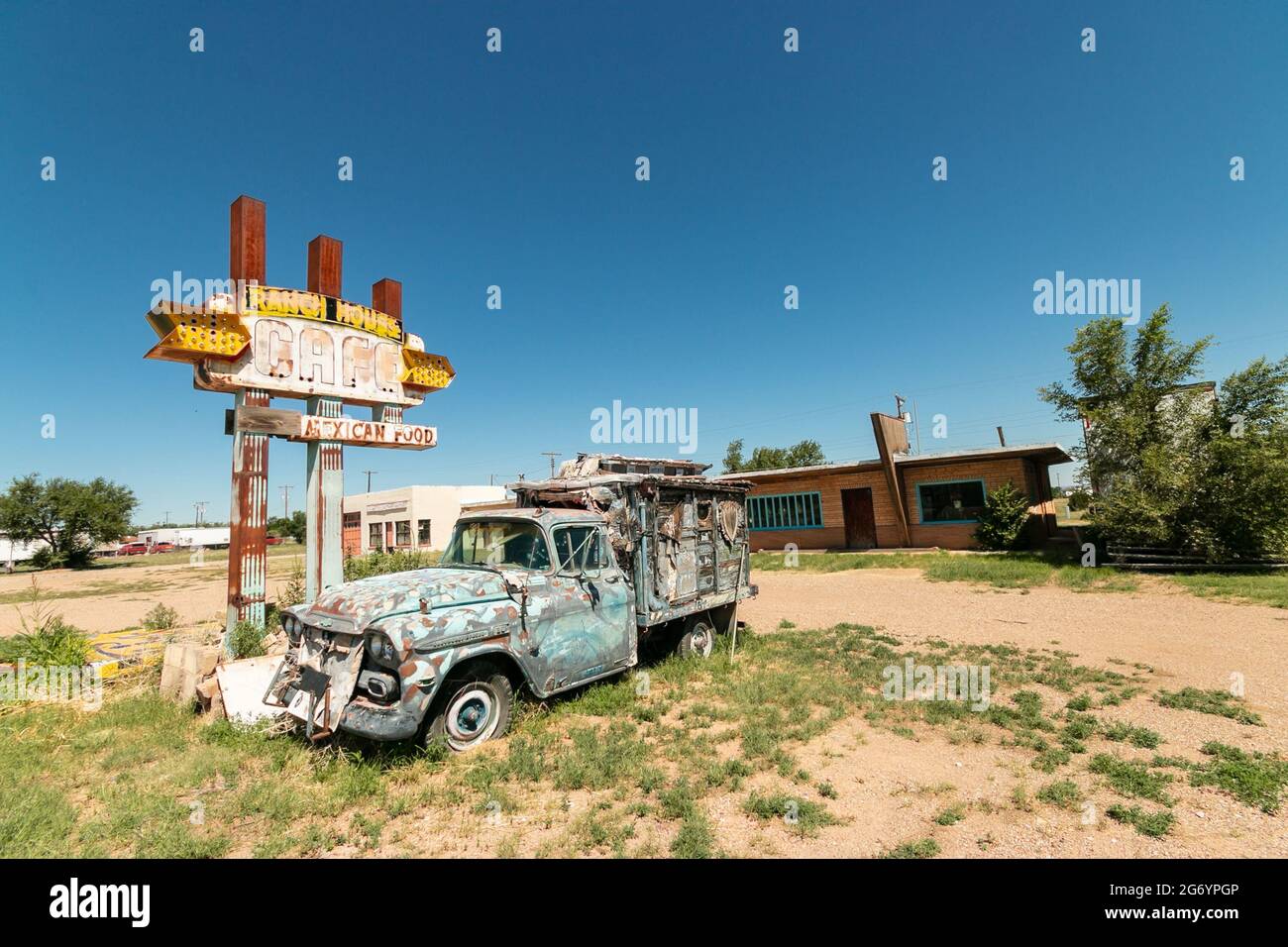 Ranch house Mexican food restaurant sign with dilapidated old truck on