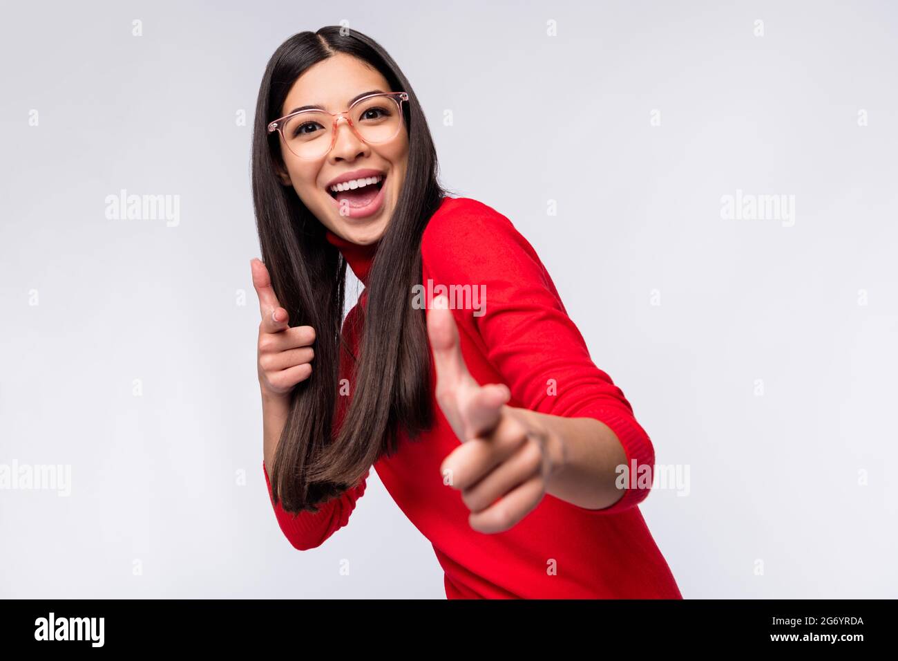 Photo of happy excited good mood asian woman in glasses point fingers you camera isolated on grey color background Stock Photo