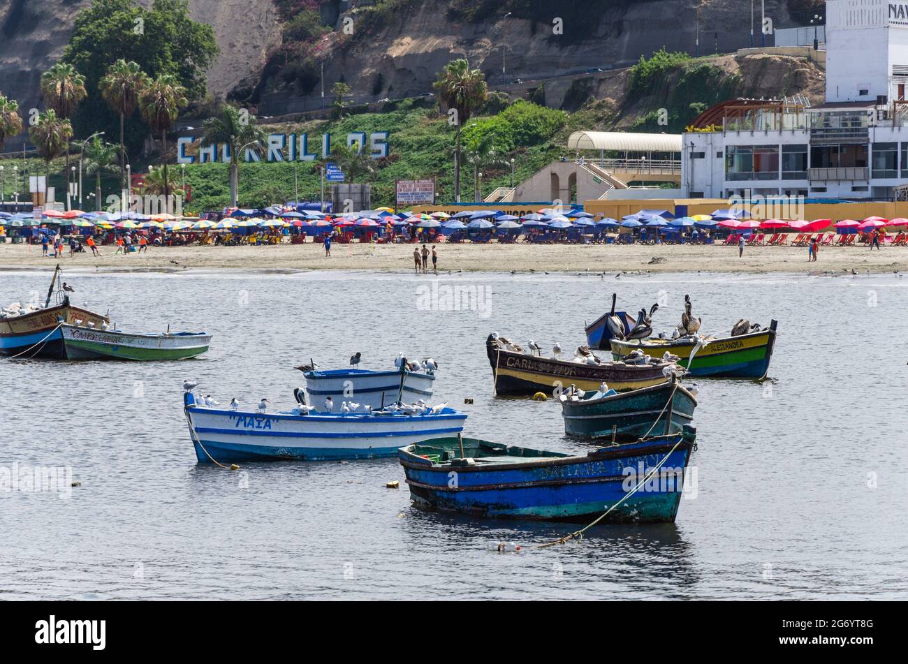 Beautiful boats in the beach Pescadores en Chorrillos , Lima- Peru. Stock Photo