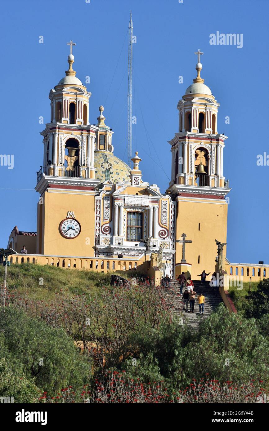 The Iglesia de Nuestra Señora de los Remedios is a 16th-century Mexican Catholic  church built atop the Tlachihualtepetl pyramid in Cholula, Puebla. Stock Photo