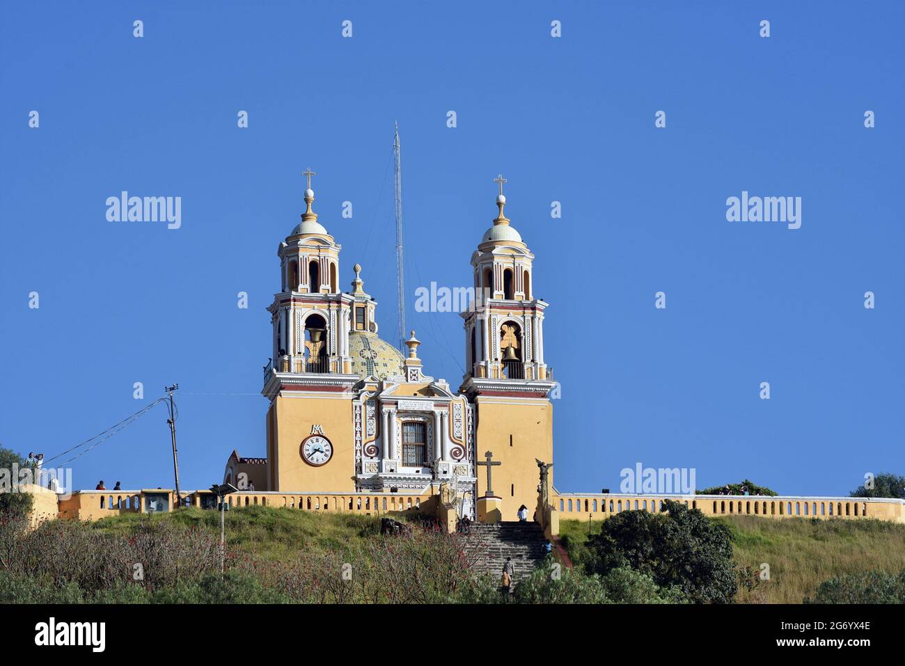 The Iglesia de Nuestra Señora de los Remedios is a 16th-century Mexican Catholic  church built atop the Tlachihualtepetl pyramid in Cholula, Puebla. Stock Photo