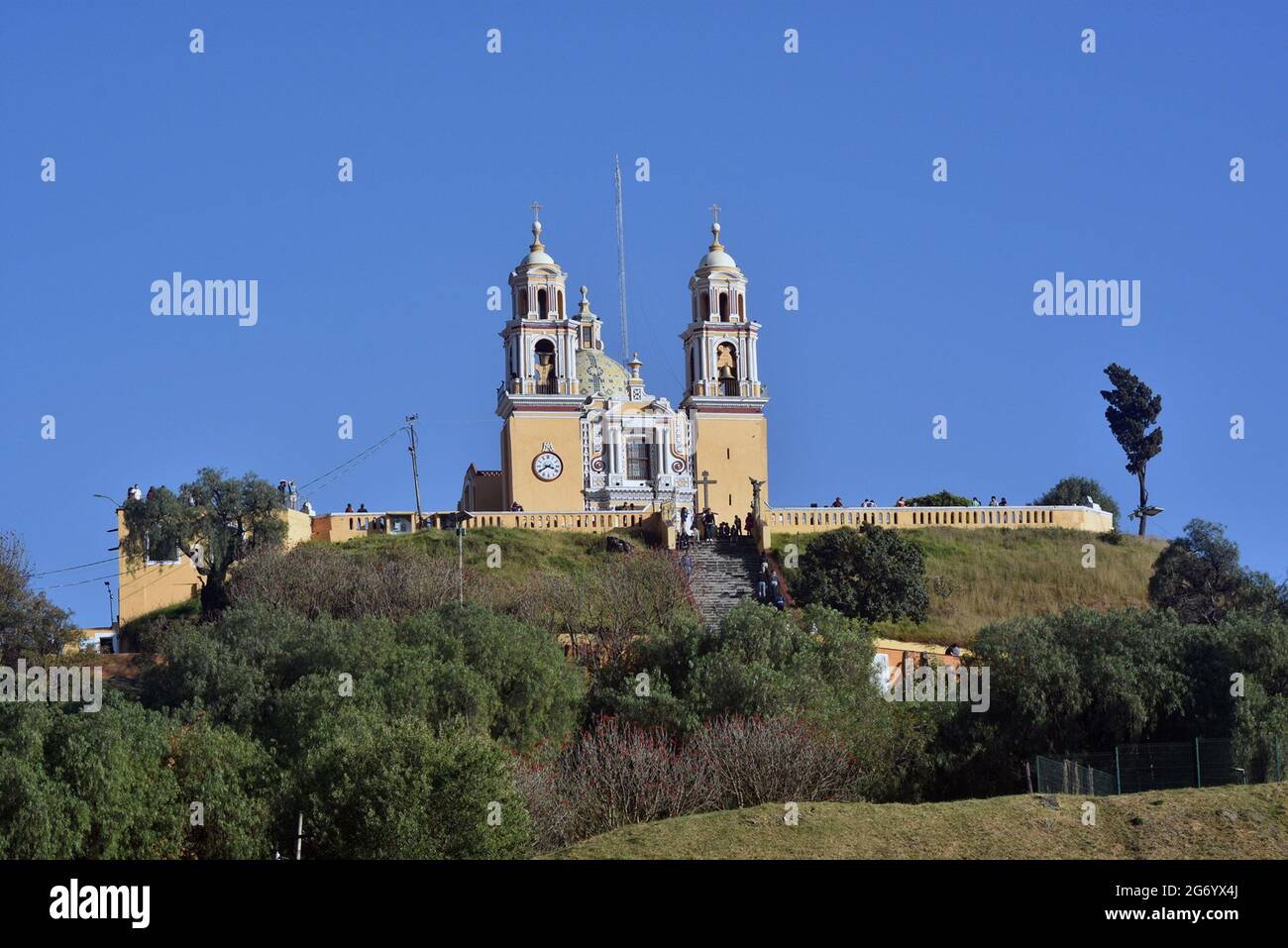 The Iglesia de Nuestra Señora de los Remedios is a 16th-century Mexican Catholic  church built atop the Tlachihualtepetl pyramid in Cholula, Puebla. Stock Photo