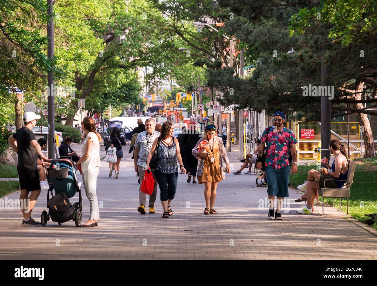 TORONTO, CANADA - 06 05 2021: Torontonians walking along Grange Park alley in downtown Toronto with John street crossing Stephanie, Queen, Richmond Stock Photo