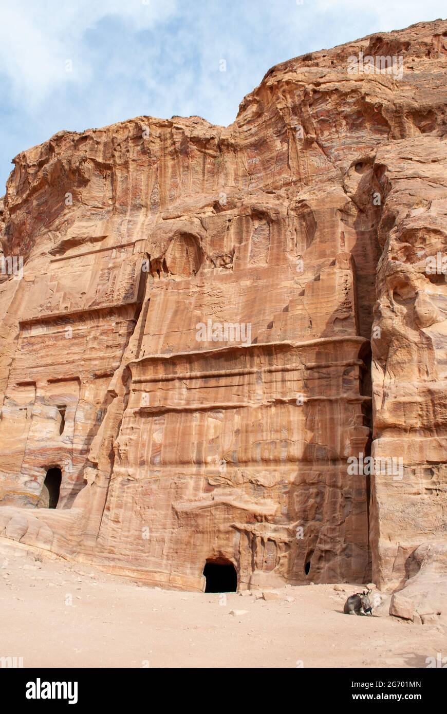 The ancient city of Petra in Jordan became one of the 7 New Wonders of the World. The city's carved rose-red sandstone rock facades, tombs, and temple Stock Photo