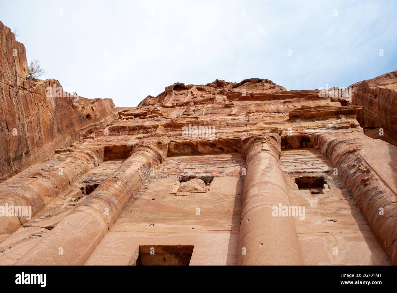 The ancient city of Petra in Jordan became one of the 7 New Wonders of the World. The city's carved rose-red sandstone rock facades, tombs, and temple Stock Photo