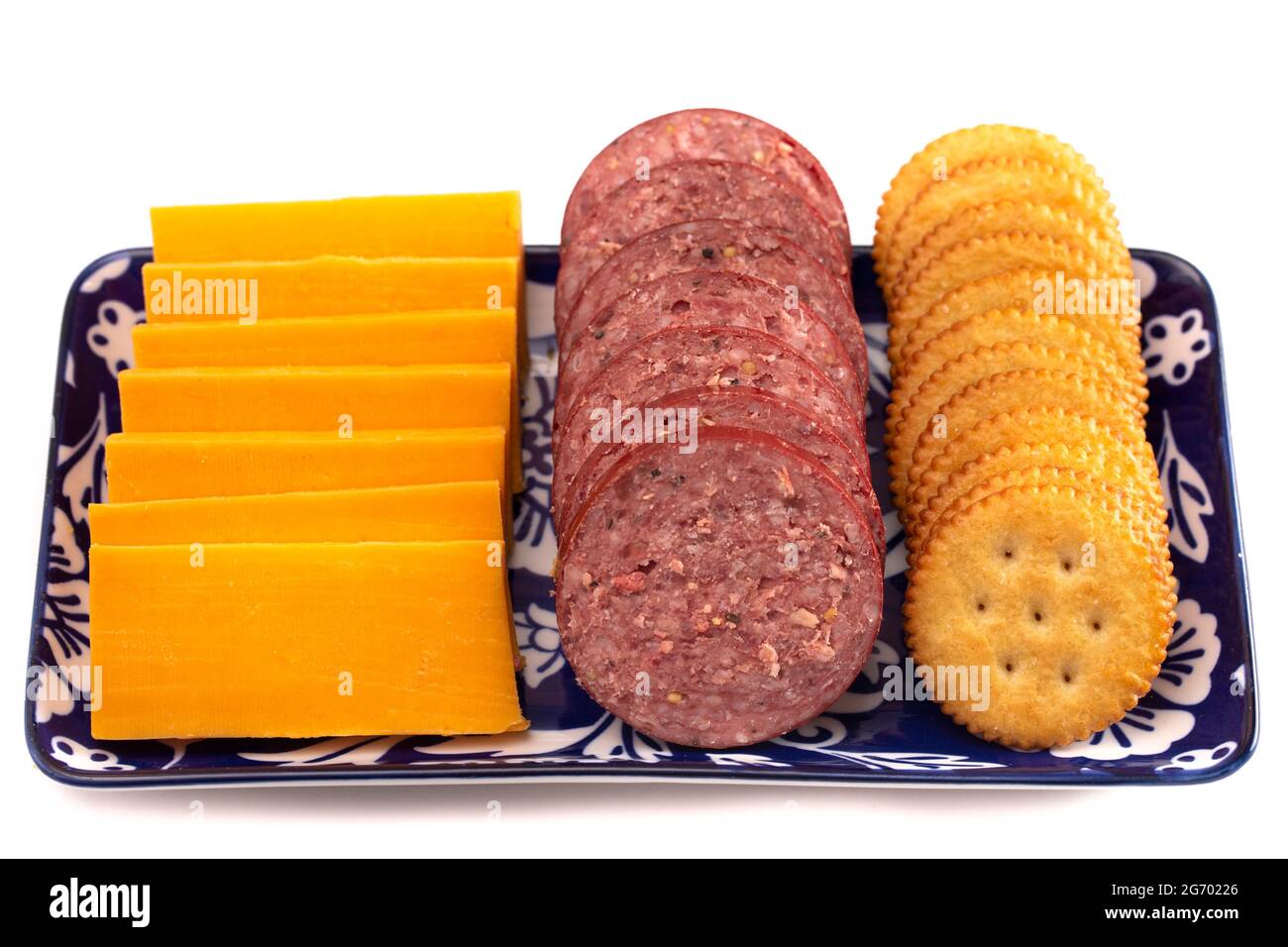 Summer Sausage Crackers and Cheddar Cheese on a White Background Stock