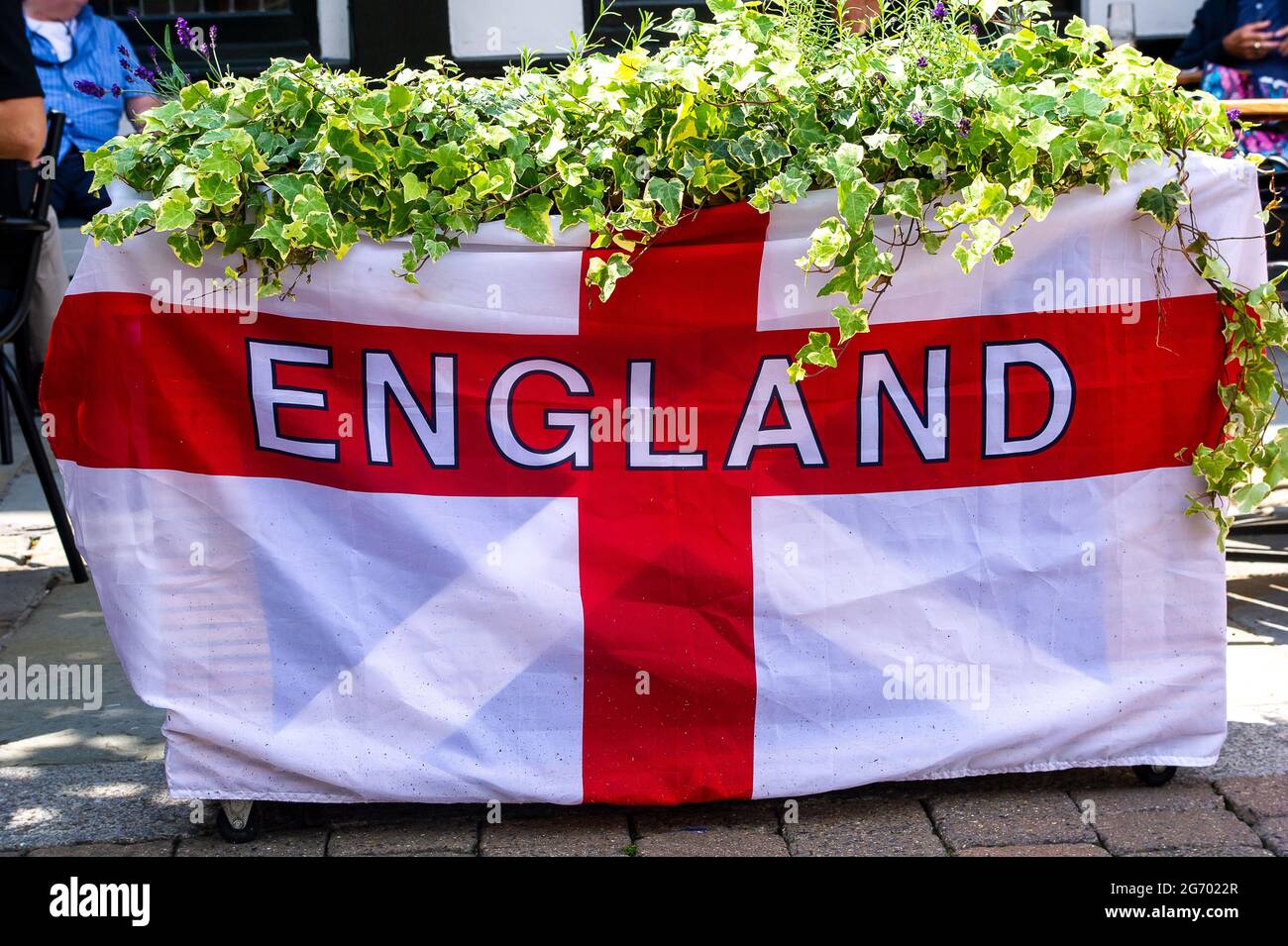 Uxbridge, London Borough of Hillingdon, UK. 9th July, 2021. The Three Tuns pub in Uxbridge has England flags and bunting outside as they get ready for the big UEFA Euro 2020 final this Sunday between England and Italy . Credit: Maureen McLean/Alamy Live News Stock Photo