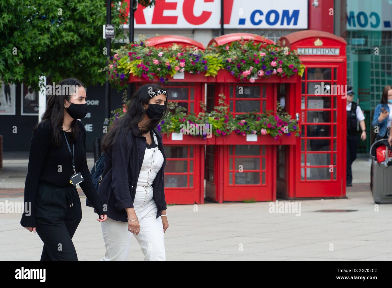 Uxbridge, London Borough of Hillingdon, UK. 9th July, 2021. Shoppers wearing face masks as they were out shopping in Uxbridge Town Centre today. Boris Johnson is expected lift the legal requirement of the wearing of face masks in shops from 19th July 2021 but this is causing concern amongst many shop workers about their safety as the number of Covid-19 postive is increasing on a daily basis. Credit: Maureen McLean/Alamy Stock Photo