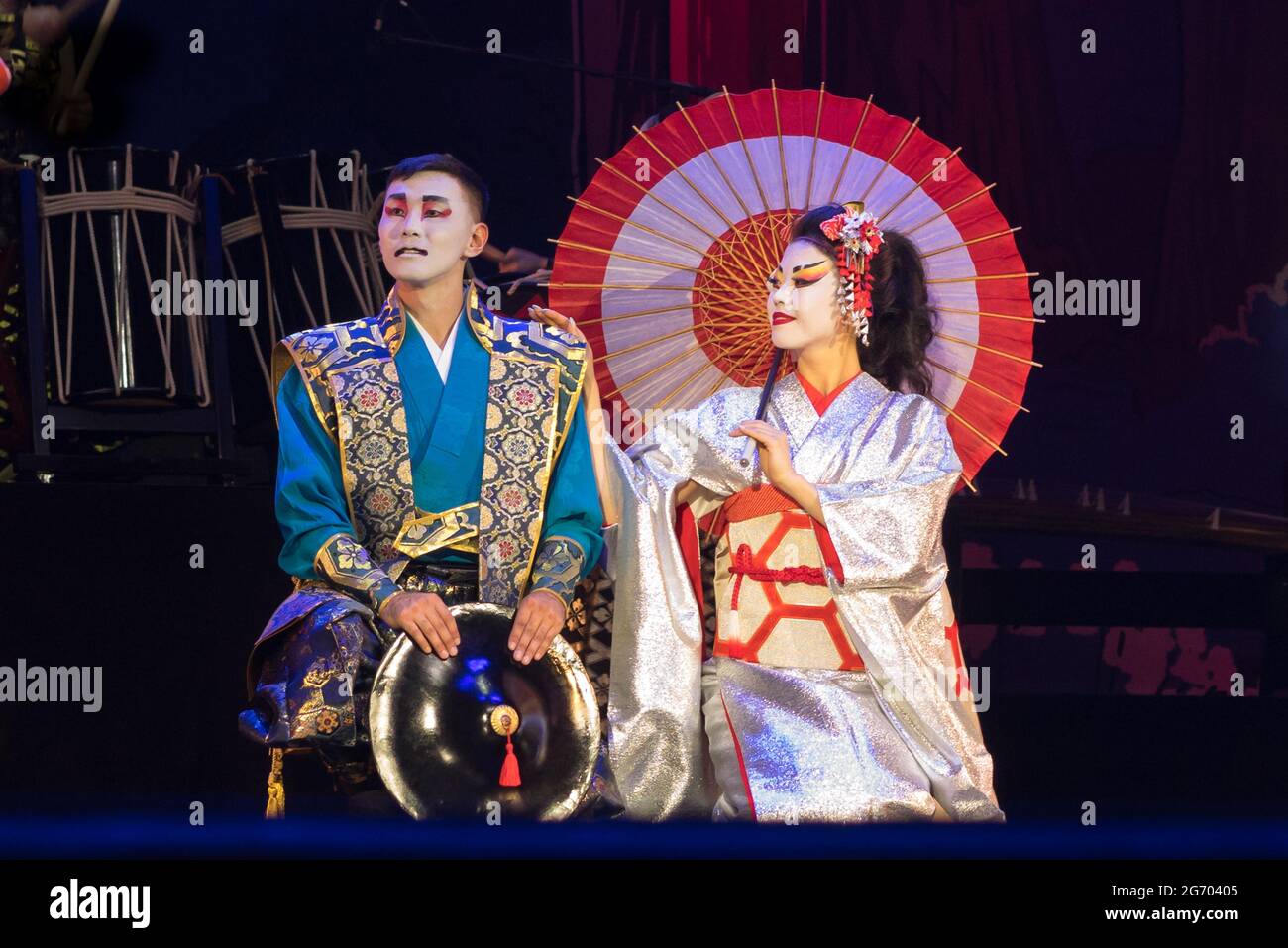 Japanese couple in traditional costumes are sitting on the knees Stock Photo