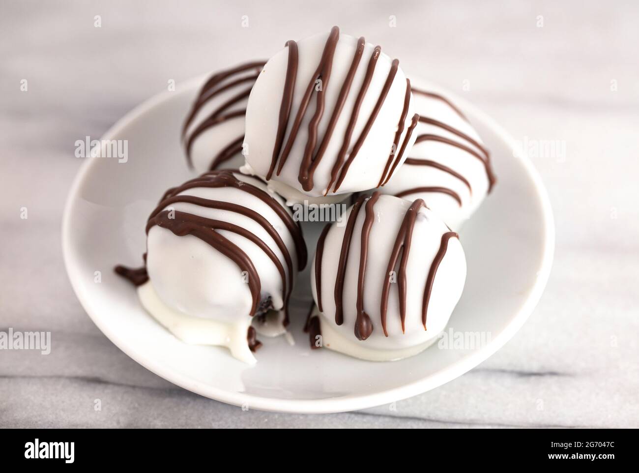 White Chocolate Covered Chocolate Sandwich Cookie Truffles Stock Photo