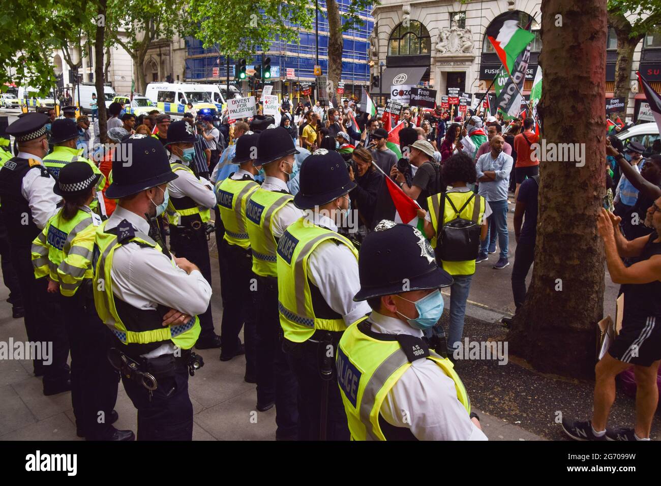 London, UK. 9th July 2021. Protesters and police gather outside the offices of Elbit Systems during the Student Protest For Palestine. Demonstrators marched to various universities in central London demanding they divest from "all companies complicit in Israeli violations of international law" and that they sever "all links with complicit Israeli institutions".  (Credit: Vuk Valcic / Alamy Live News) Stock Photo