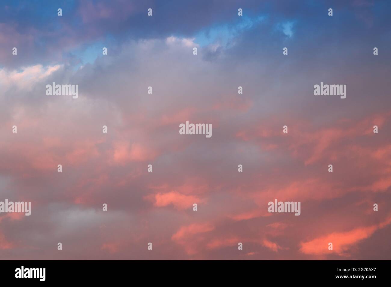 Sunset sky with yellow orange clouds - contrast between warm and cold ...