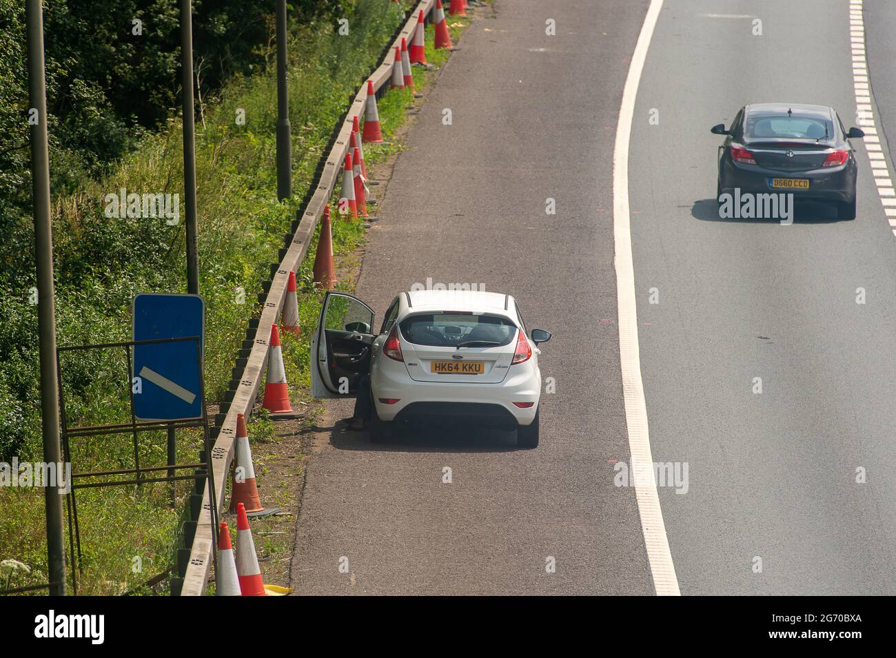 Iver, Buckinghamshire, UK. 9th July, 2021. A broken down car looks