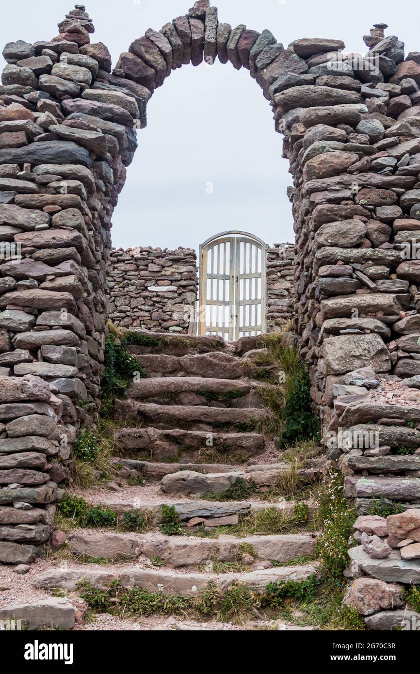 Gate to the temple on Pachamama hill on Amantani island in Titicaca lake, Peru Stock Photo