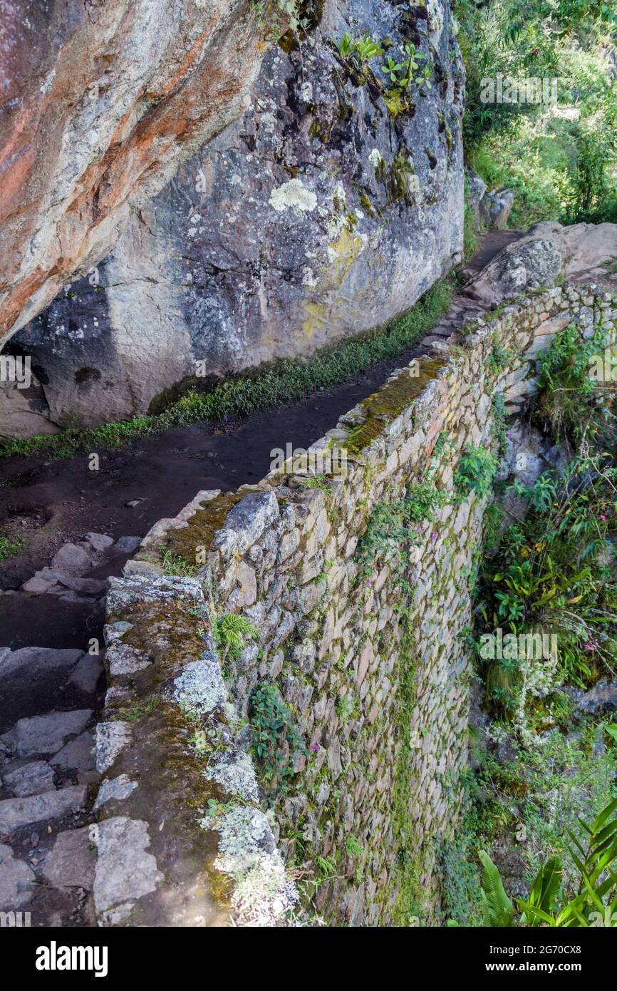 Inca trail carved into a stone wall near Machu Picchu ruins, Peru Stock ...