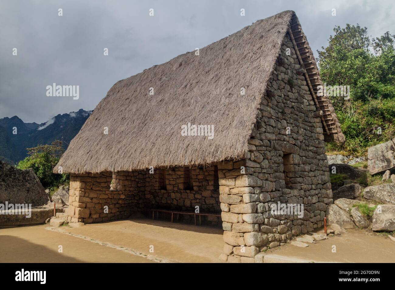 House near ceremonial rock at Machu Picchu ruins, Peru Stock Photo - Alamy