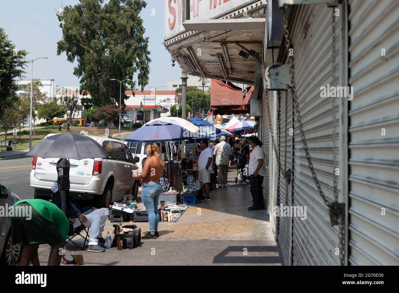 Los Angeles, CA USA - August 20, 2020: Street vendors operate in front of closed retail businesses during the coronavirus pandemic lockdowns Stock Photo