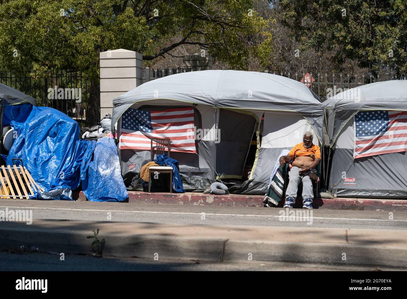 Los Angeles, CA USA - Julyl 3, 2021: A homeless veteran sitting outside ...