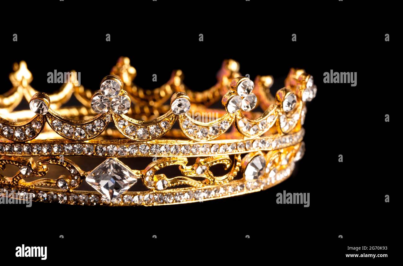 Golden Crown Isolated on a Black Background Stock Photo - Alamy