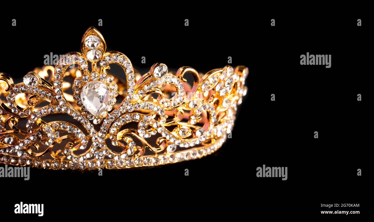 Golden Crown Isolated on a Black Background Stock Photo - Alamy