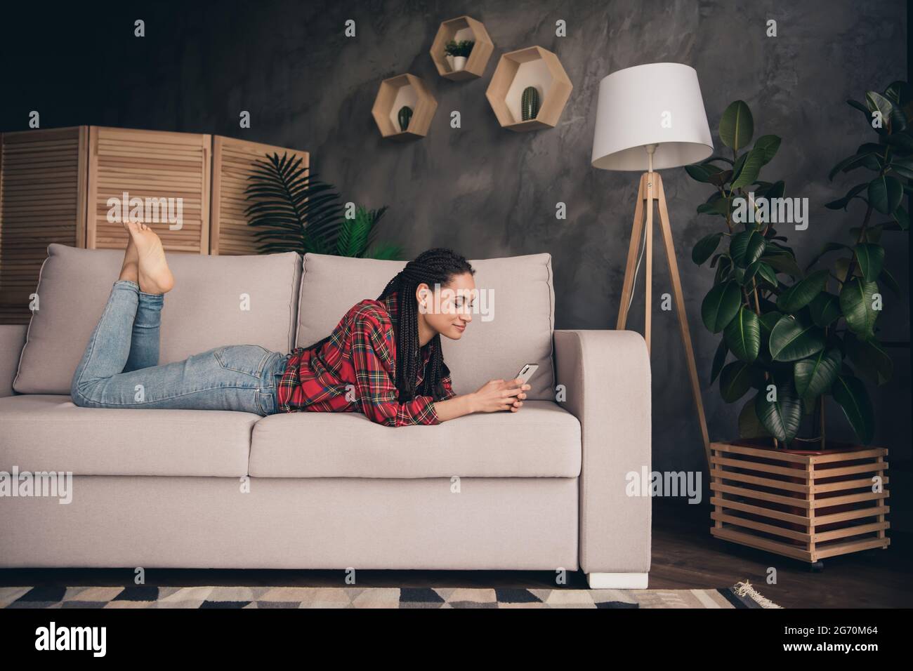 Barefoot girl lying on couch hi-res stock photography and images - Alamy
