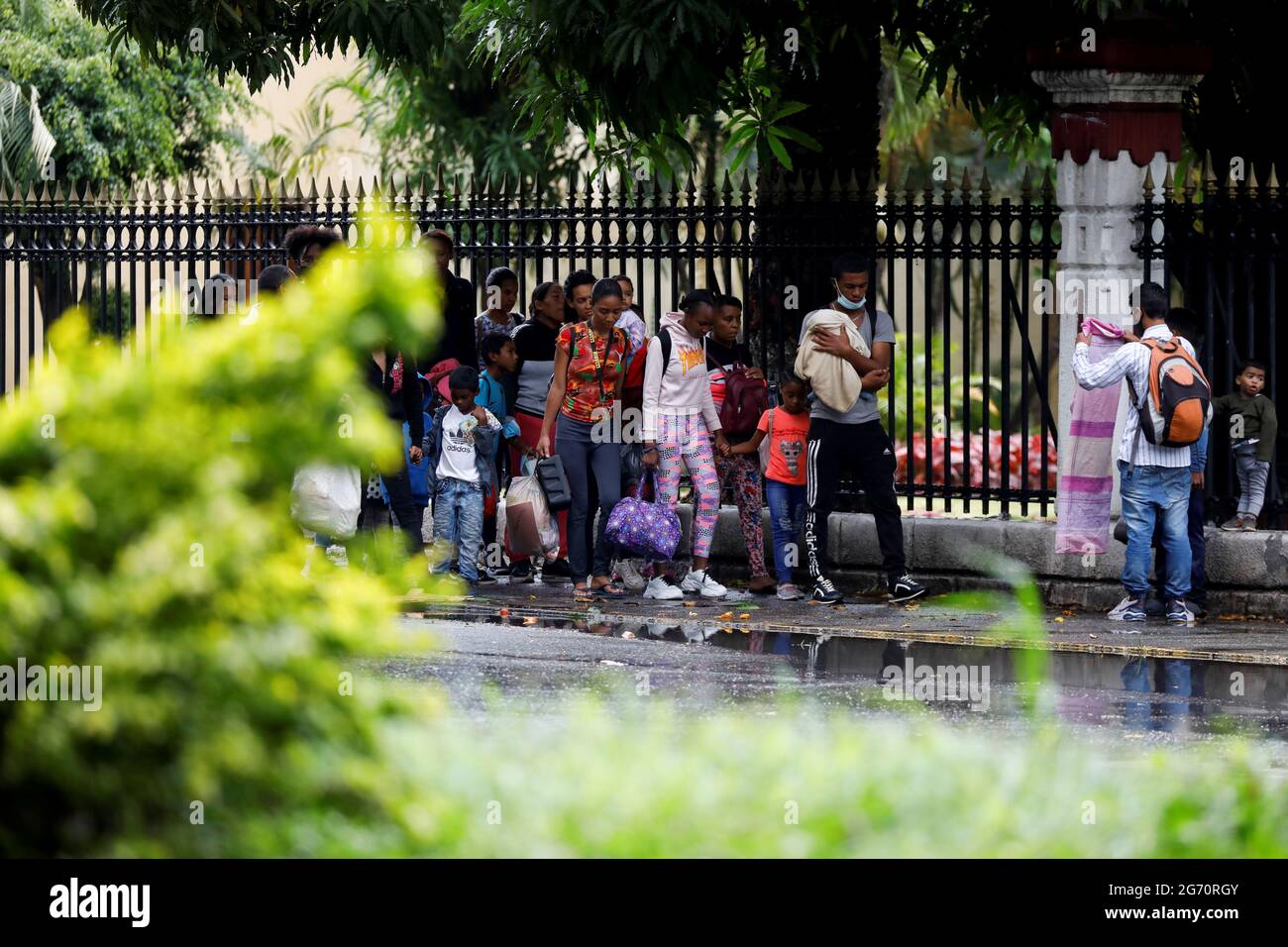 Residents leave their homes in the COTA 905 neighborhood during armed  confrontations with members of the Koki criminal gang in Caracas, Venezuela  July 9, 2021. REUTERS/Leonardo Fernandez Viloria Stock Photo - Alamy