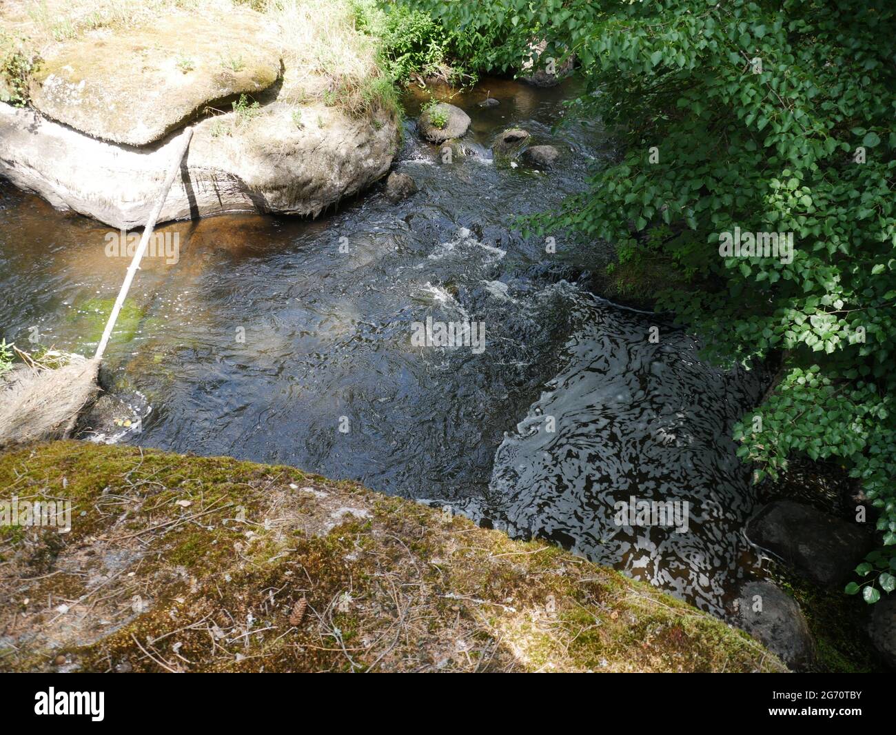 River Surrounded By Rocks River surrounded by huge rocks in the forest Stock Photo - Alamy
