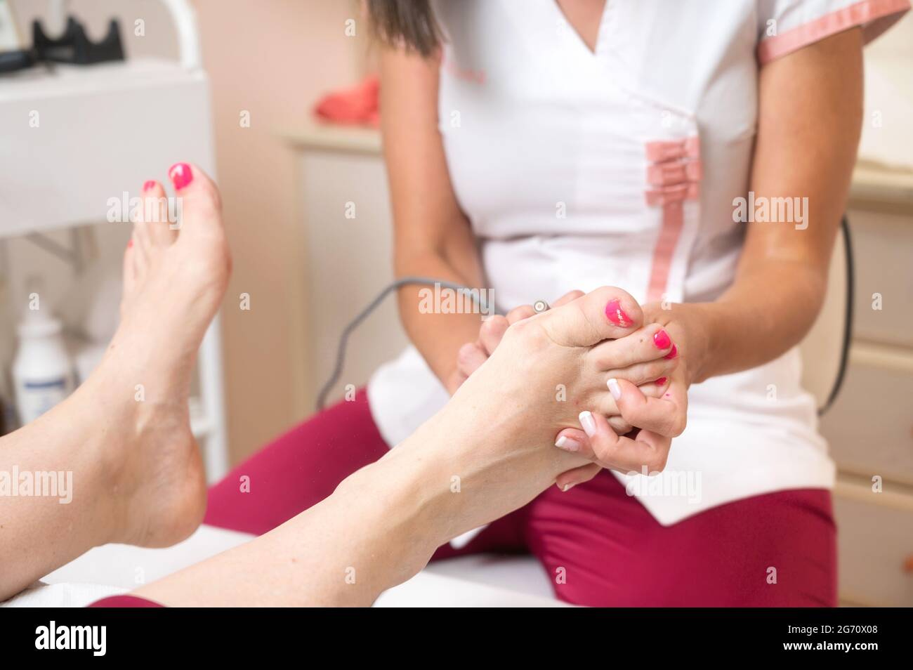 Medicinal Pedicure. The Doctor Removes The Imprint On The Foot With A  Scalpel Stock Photo, Picture and Royalty Free Image. Image 77227900.