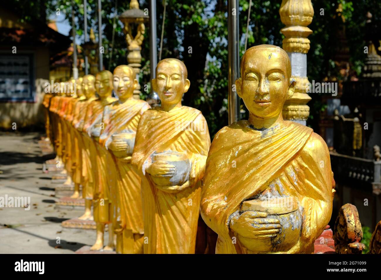Cambodia Sihanoukville - Kampong Som - Wat IntNhean - Wat Krom Golden Buddha statues Stock Photo
