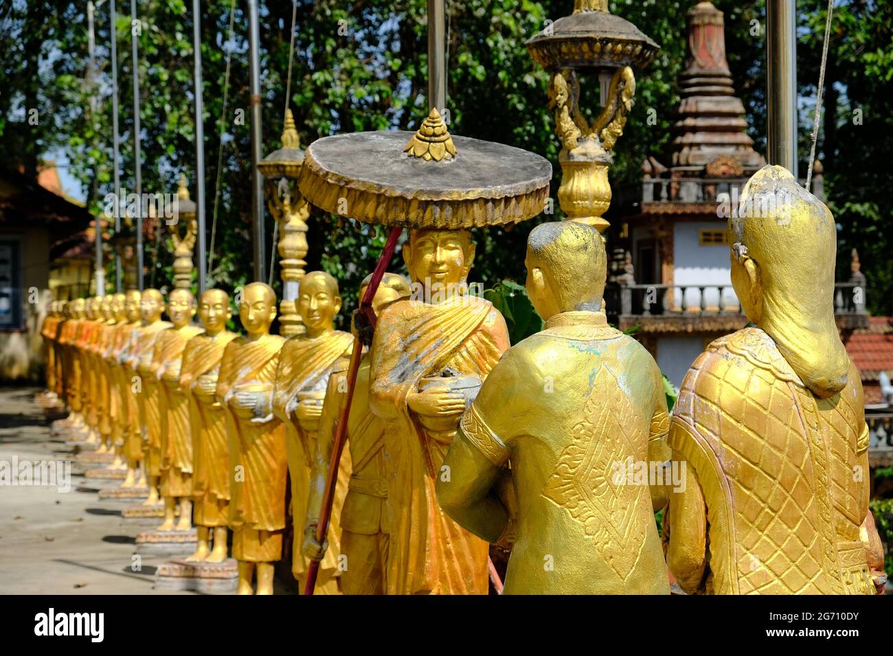 Cambodia Sihanoukville - Kampong Som - Wat IntNhean - Wat Krom Golden Buddhist statues Stock Photo
