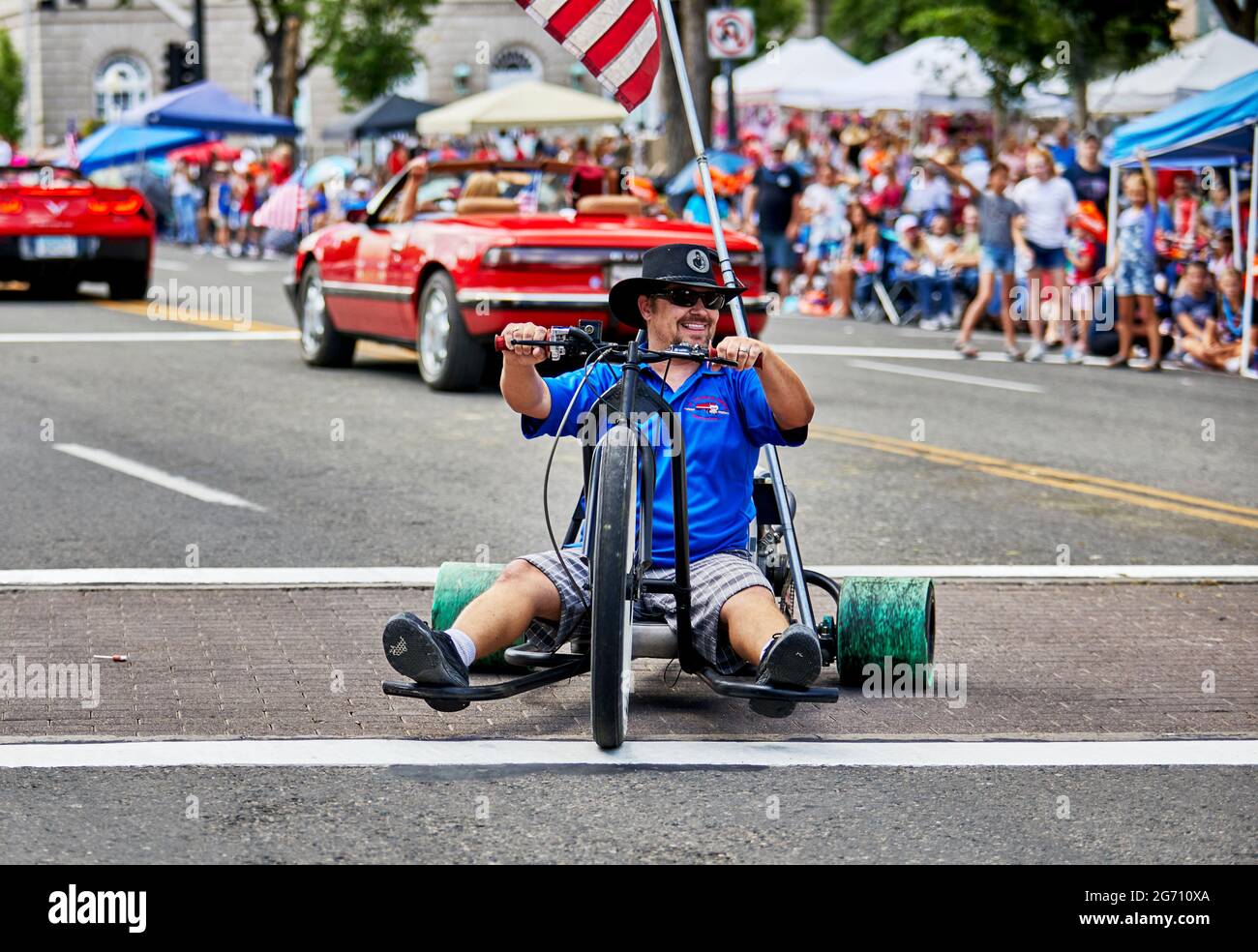 Prescott, Arizona, USA - July 3, 2021: Man driving a go cart in the 4th of July parade Stock Photo