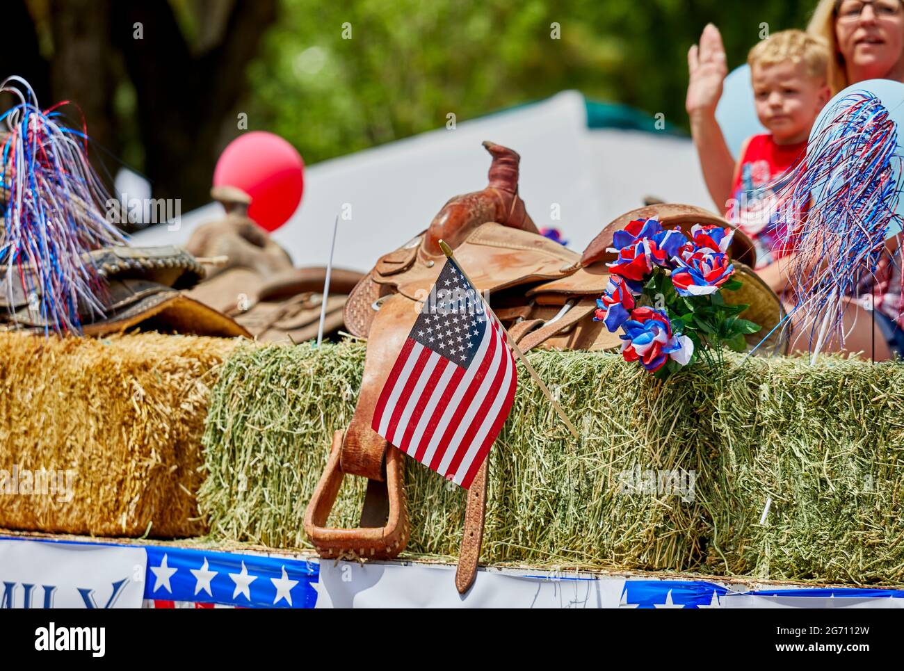 Prescott, Arizona, USA - July 3, 2021: Western Saddle with an American flag on a float in the 4th of July parade Stock Photo