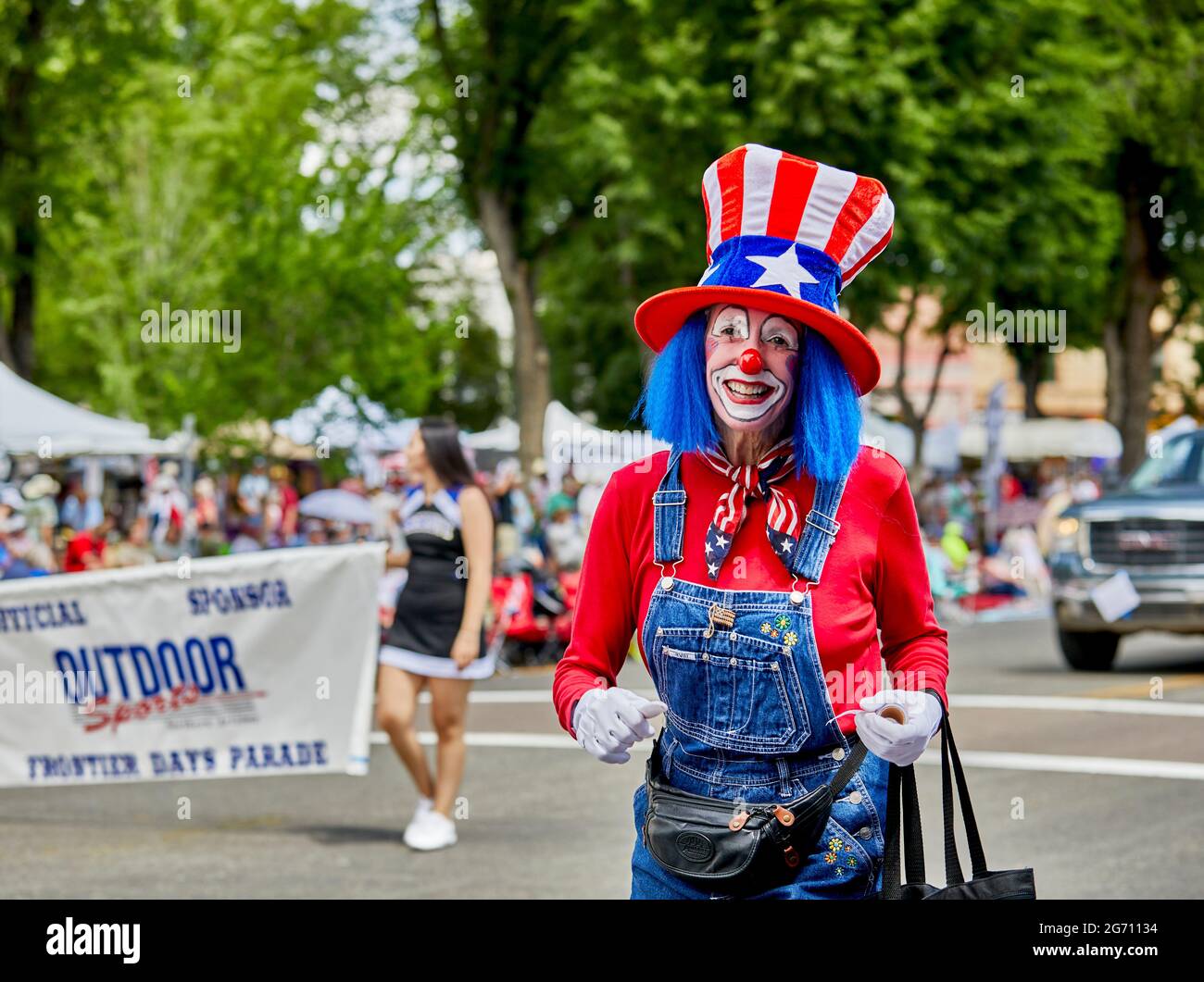 Prescott, Arizona, USA - July 3, 2021: Woman dressed in clown costume while marching in the 4th of July parade Stock Photo