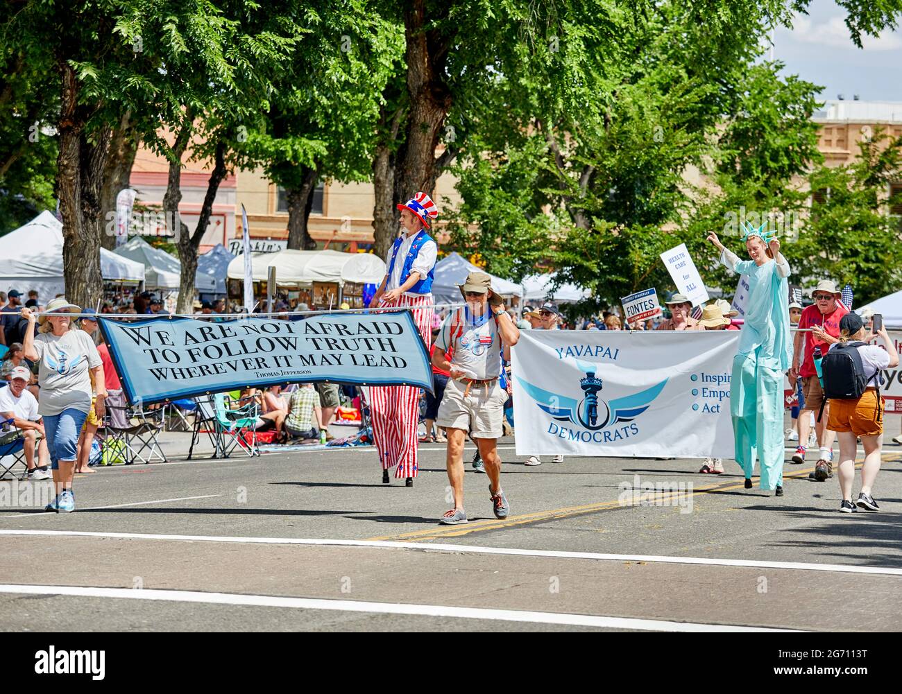 Prescott, Arizona, USA - July 3, 2021: Yavapai Democrats carrying a banner and dressed in costume while marching in the 4th of July parade Stock Photo