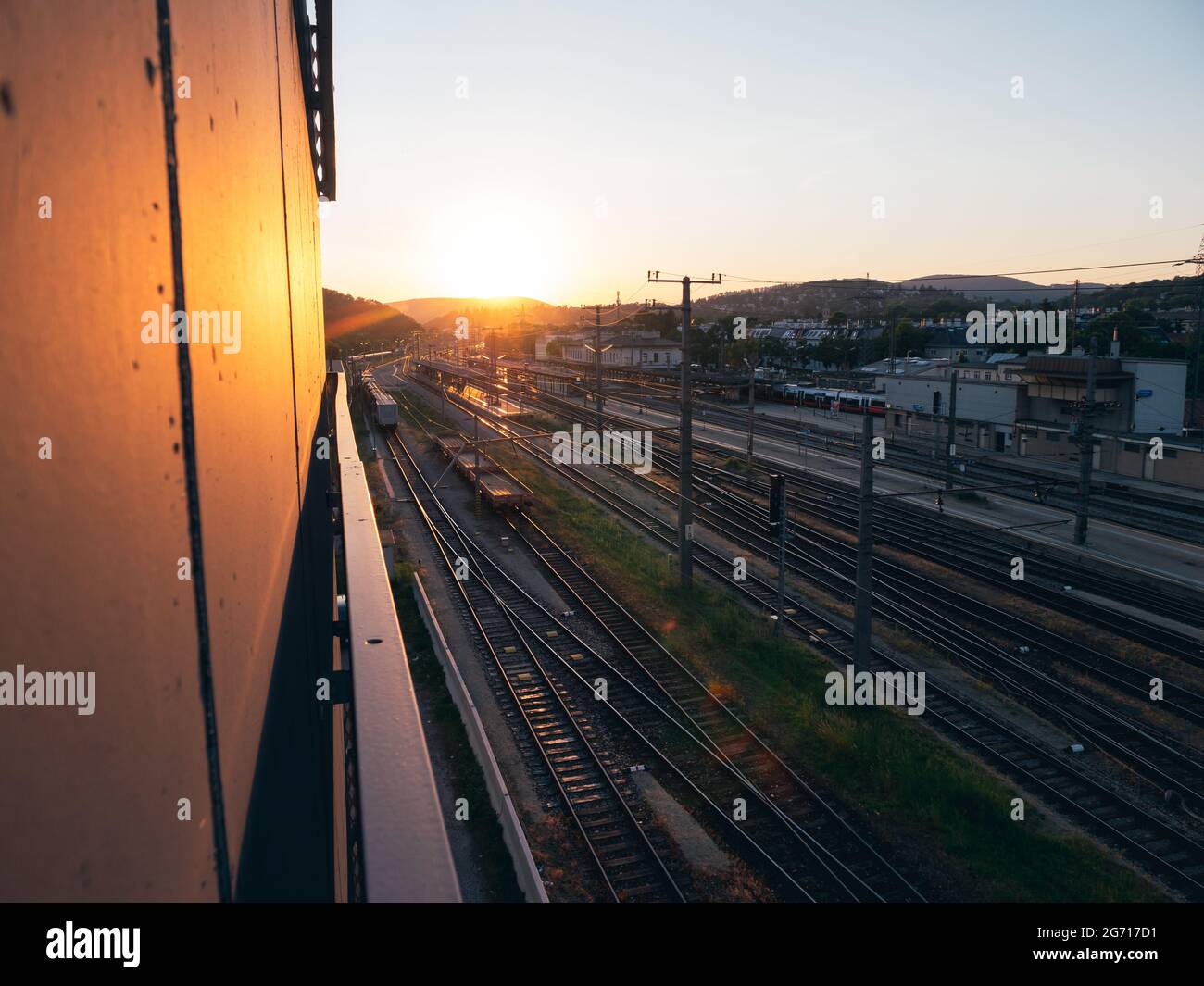 Sunset at Wien Huetteldorf Train Station in Vienna, Austria with Railway Tracks From Above Stock Photo