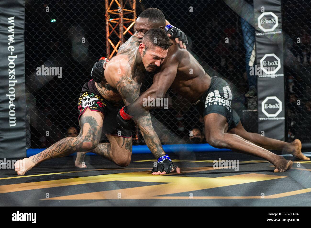 Paris, France. 09th July, 2021. French MMA fighter Alix Jeanguillaume (L.)  fights against French fighter Onefel Mackoumbou in the under 70kgs category  of the first edition of the MMA Hexagone, a Mixed