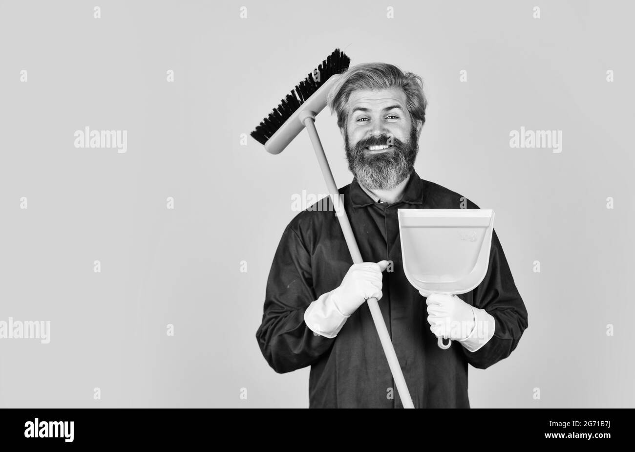 spring cleaning. clean service people. mature male worker with broom