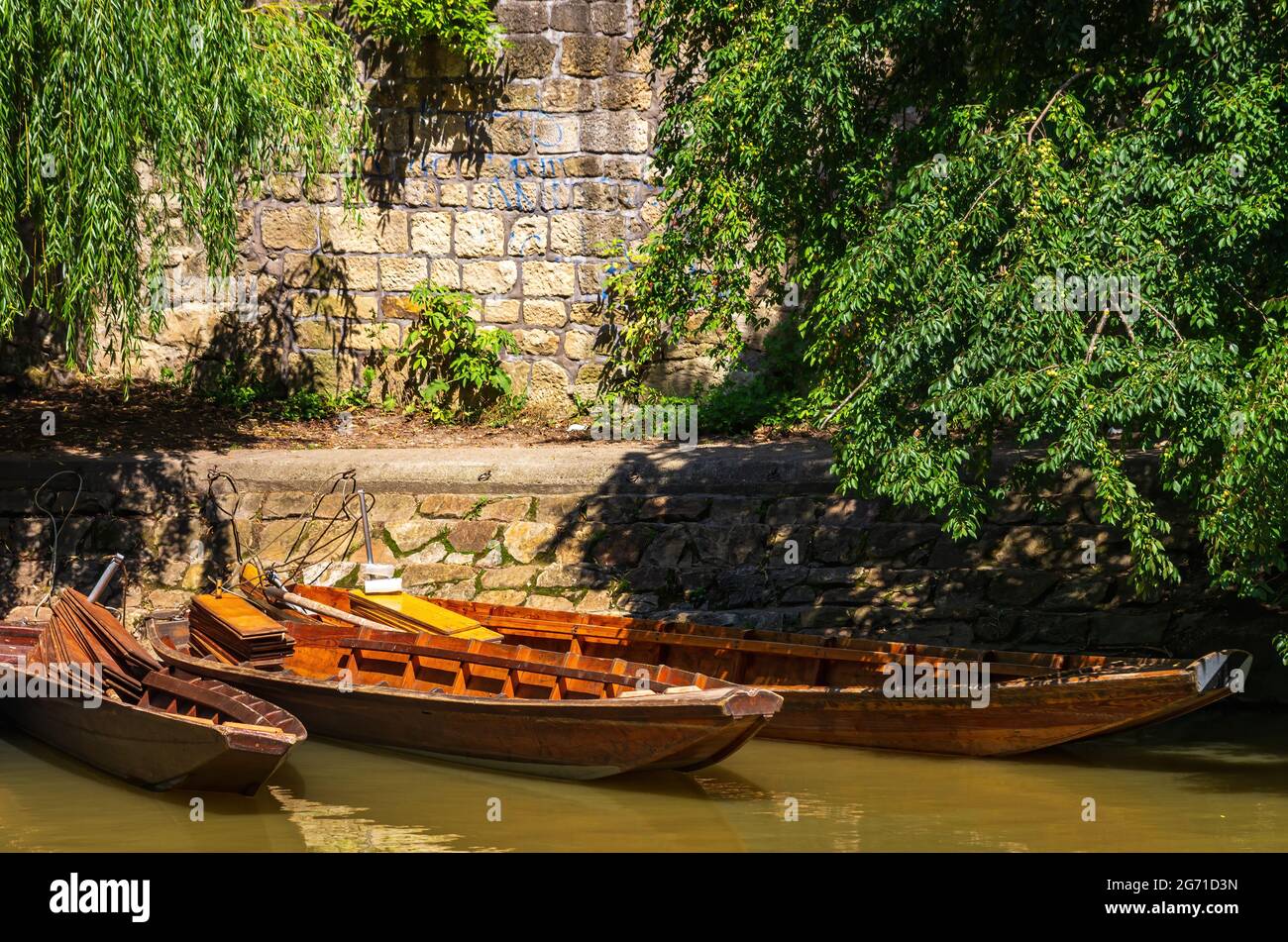 Punting boats by the side of the Neckar Waterfront in Tübingen, Baden-Württemberg, Germany. Stock Photo