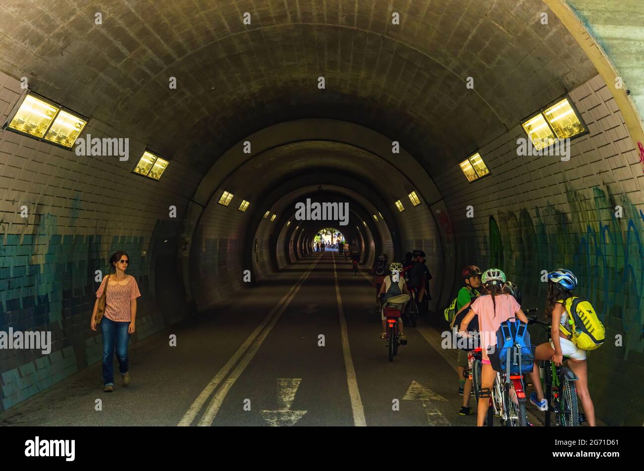 Tübingen, Baden-Württemberg, Germany: Pedestrian and cyclist tunnel, north portal of Schlossberg tunnel with busy traffic situation. Stock Photo