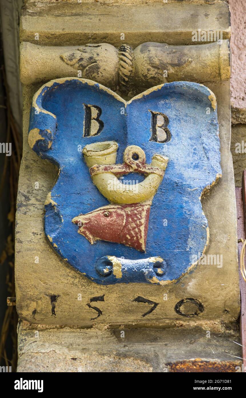 Tübingen, Baden-Württemberg, Germany: Historical house mark, also house sign, with the depiction of a fish and a horn. Stock Photo