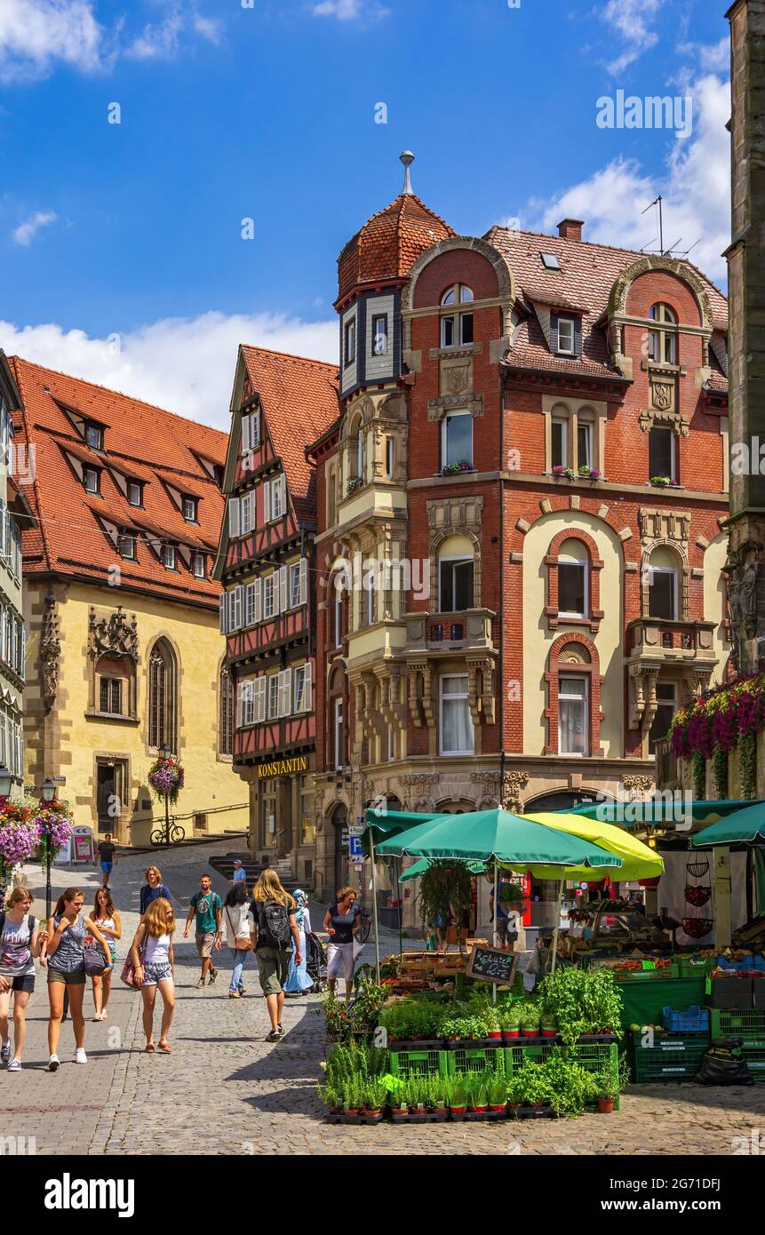 Tübingen, Baden-Württemberg, Germany: Street scene with market hustle and bustle on Holzmarkt in front of the Collegiate Church. Stock Photo