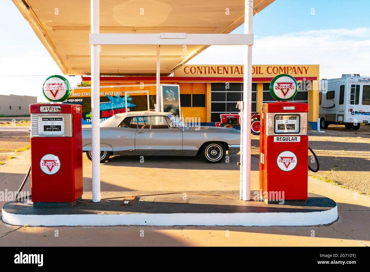 1960s vintage American car and Conoco gas pumps in front of continental oil  company gas station in Tucumcari on Route 66 Stock Photo - Alamy