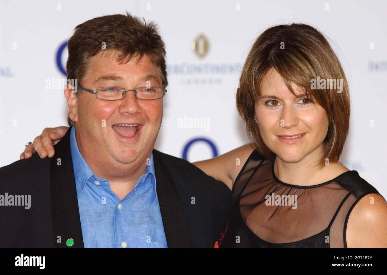 File photo dated 18/6/2004 of Radio DJ's Harriet Scott and Jonathan 'Jono' Coleman arrive for the Nordoff-Robbins 02 Silver Clef Awards Lunch at tne Intercontinental Hotel in Park Lane, central London. ributes have been paid to the radio and television presenter who has died after a battle with prostate cancer. The 65-year-old passed away peacefully on Friday with his wife and two children by his side, his family said. Issue date: Saturday July 10, 2021. Stock Photo