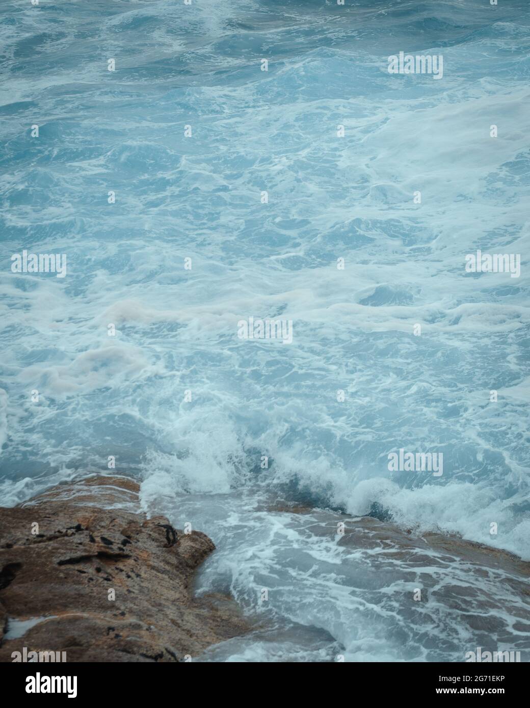 Foamy waves breaking on rocky hi-res stock photography and images - Alamy