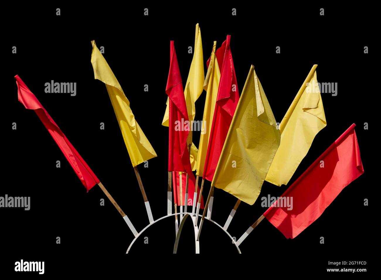 Texture of multicolored festive red, yellow flags made of fabric. Holiday celebration satin