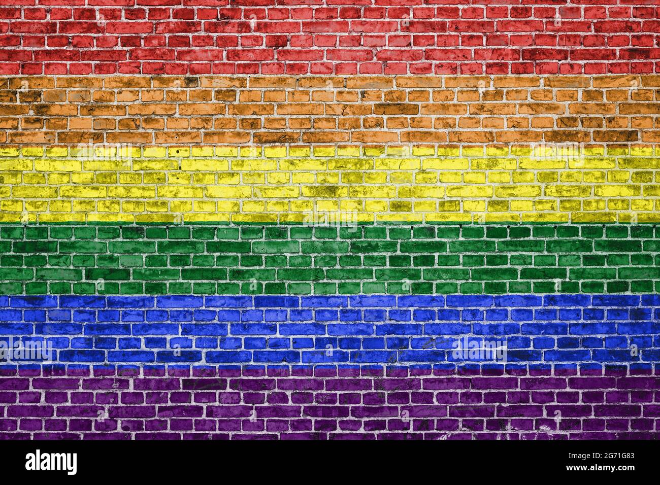 Brick wall painted in lgbt flag colours with copy space Stock Photo