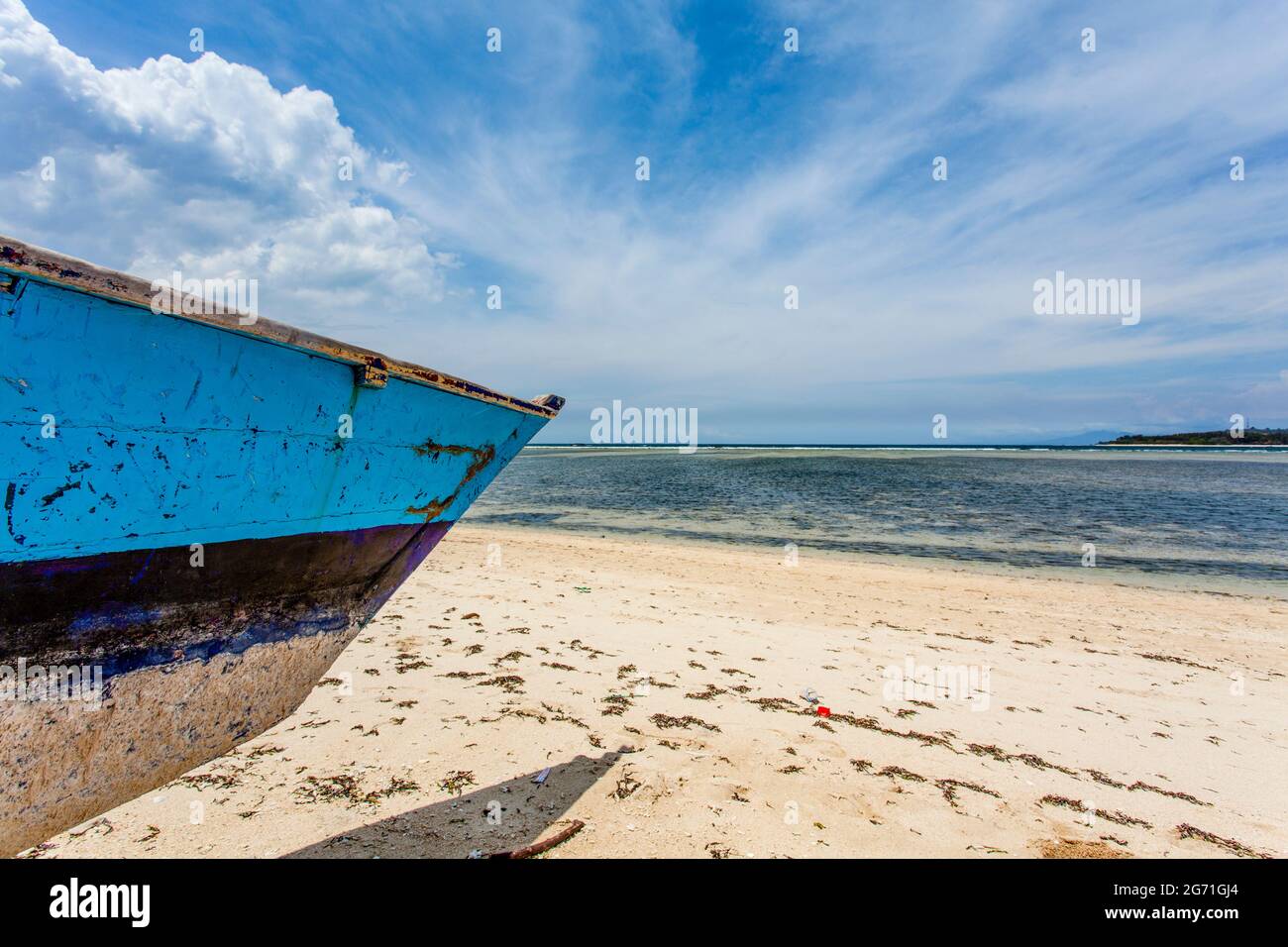Blue and white fishing boat on the beach of Gili Air, Indonesia ...