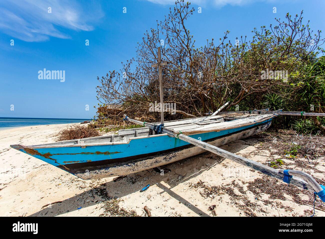 Blue and white fishing boat on the beach of Gili Air, Indonesia ...